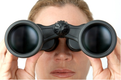 Woman looking through binoculars